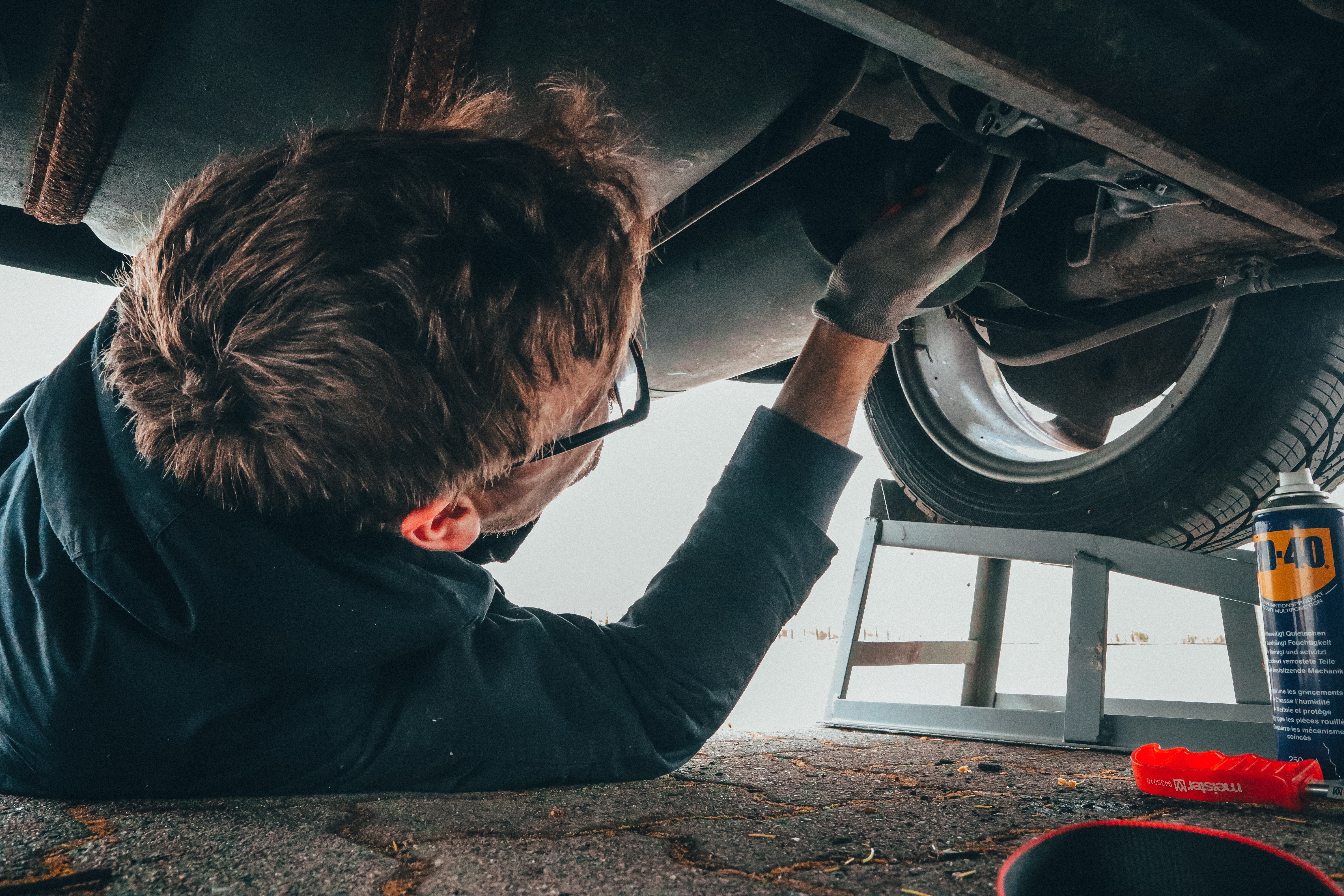 Man Checking On Engine Oil